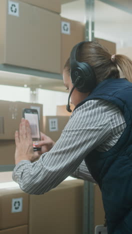 warehouse worker using a mobile device