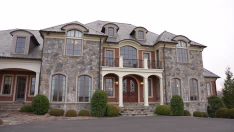 a smooth pan down shot of a beautiful stoned mansion