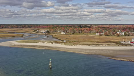 wells maine aerial v2 cinematic pan shot capturing drakes island beach, harbor marina and beautiful natural landscape of salt marsh and estuary during autumn season - october 2020