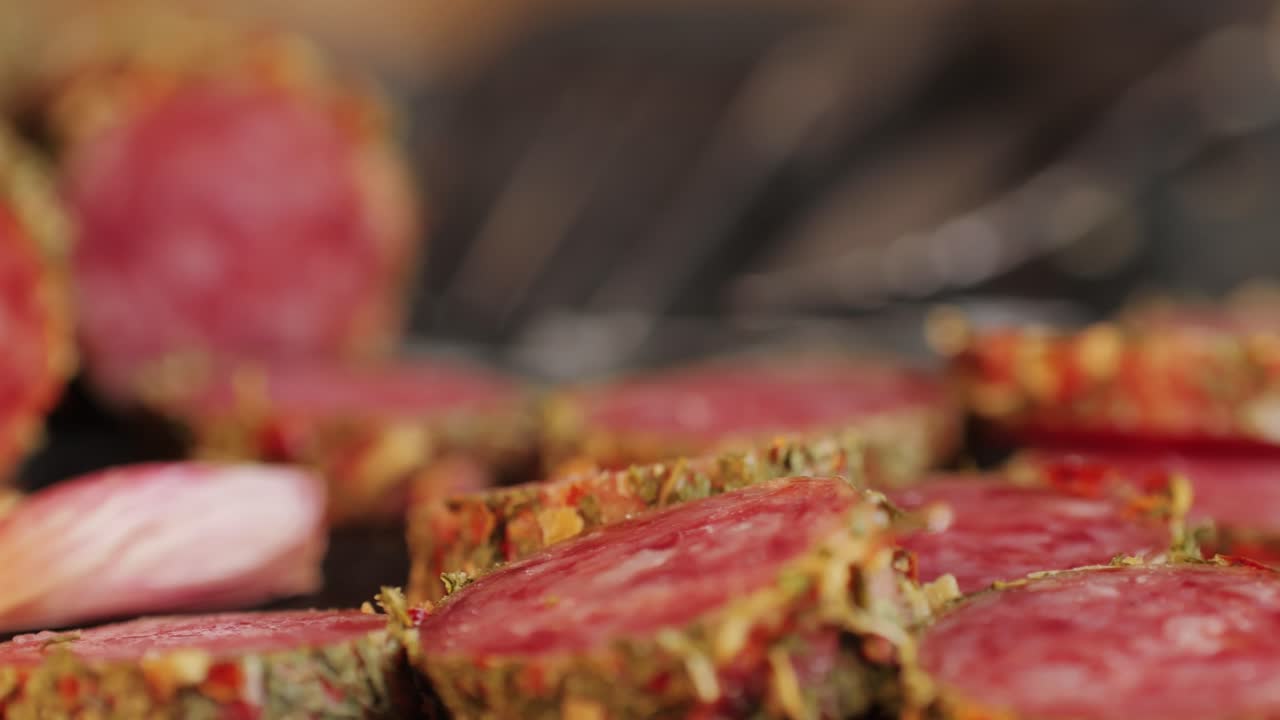 Mix of spanish pork sausages, Cutting board of appetizing catalonian snack - fuet, jamon, chorizo, olives, supermarket tapas food in spain, traditional cuisine.