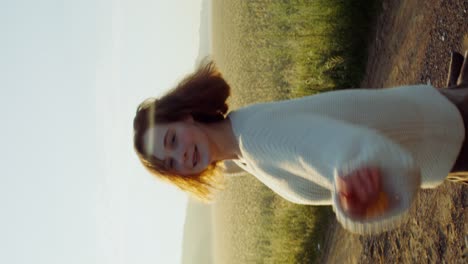 woman enjoying a beautiful sunset in a field