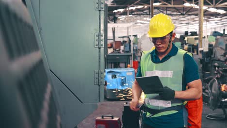 smart factory worker using machine in factory workshop