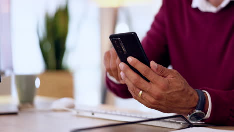 Hands,-man-typing-on-smartphone-in-office