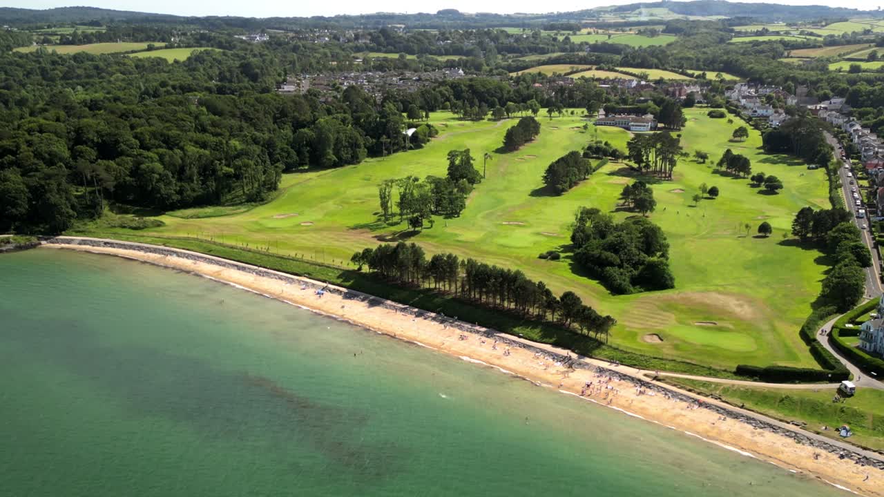 Rising overhead 4K 30FPS aerial video of Helen's Bay Beach in County Down, Northern Ireland in the UK. Edited with Rec709 color