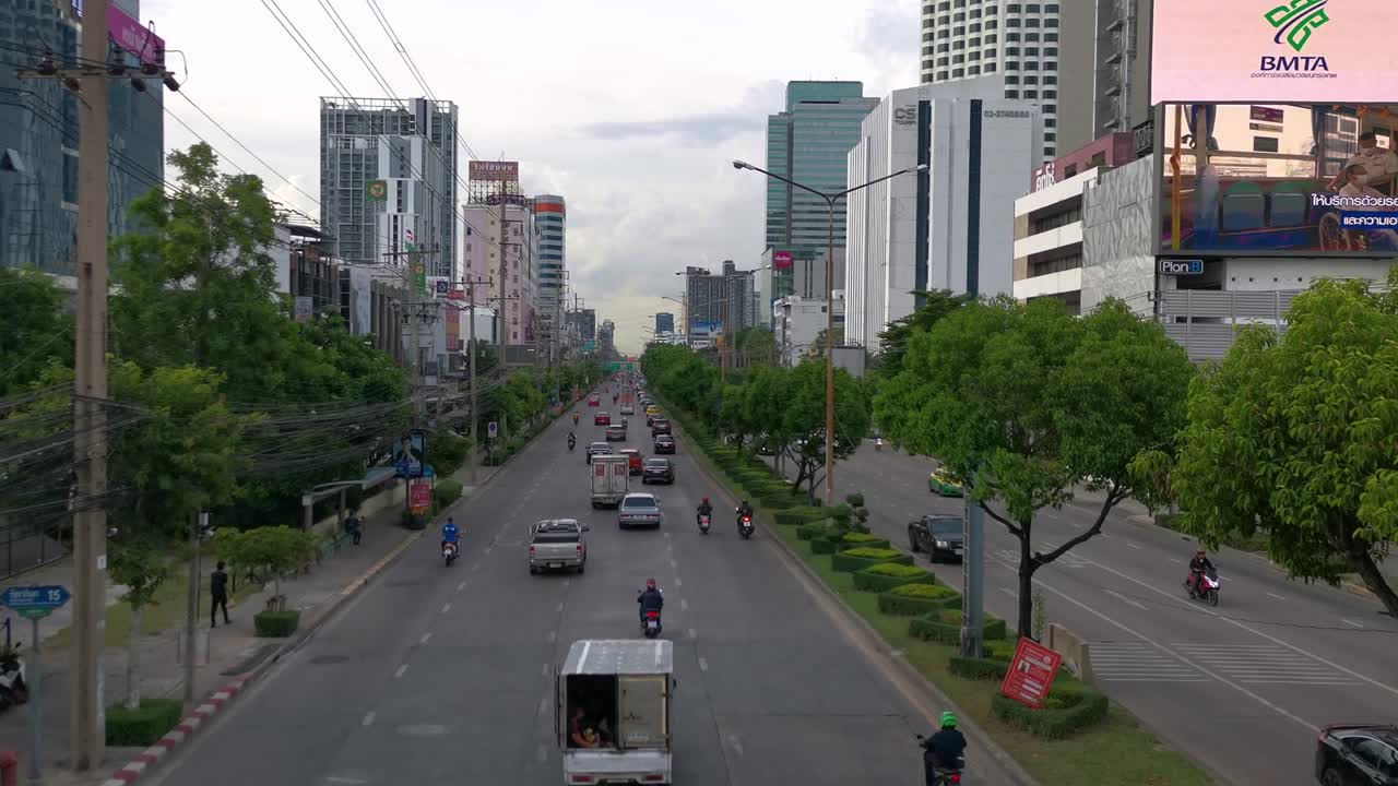 4K Vehicle Traffic From Above Road Commuting Along Ratchadaphisek Road in Bangkok, Thailand.