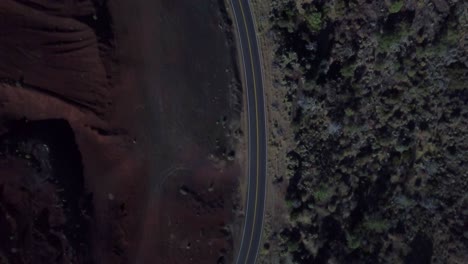 Top-down-view-on-road-next-to-dirt-and-trees-in-Northern-California-Lassen-County-in-fall