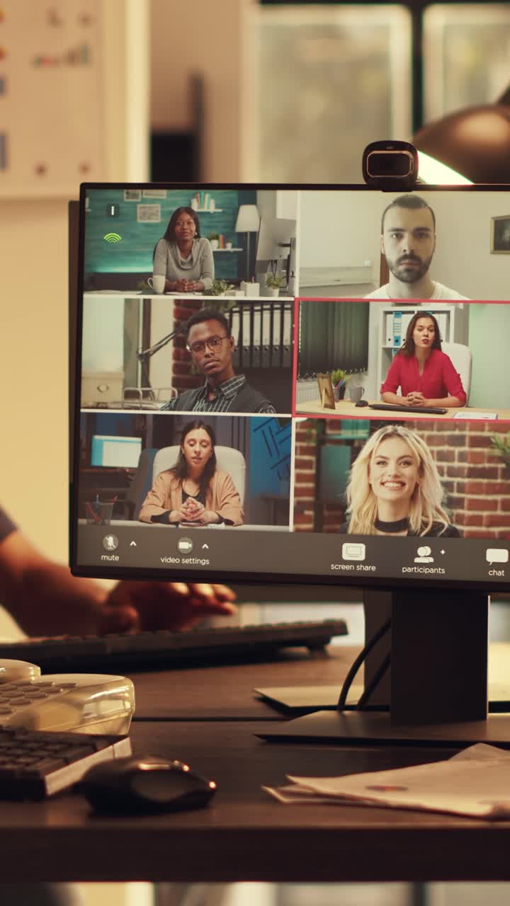 Vertical video: Female manager attending corporate videocall meeting with webcam