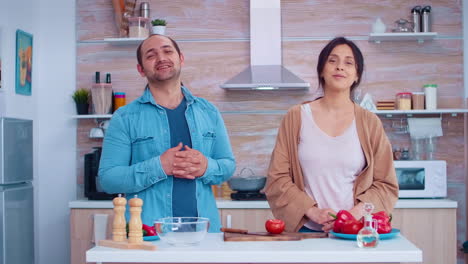 Portrait-of-couple-in-kitchen