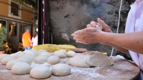 woman baking bread in a bakery