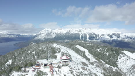 AERIAL---Cerro-Otto-grating-restaurant,-Patagonia-Andes-Mountains,-Argentina,-circle-pan