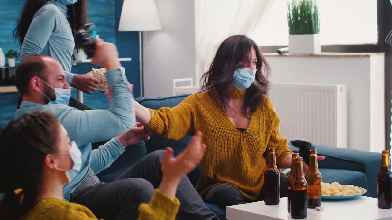 Multiracial people celebrate winning game