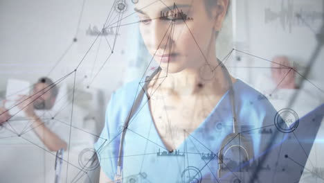 female nurse reviewing digital chart in hospital room, displaying animated medical data graphs