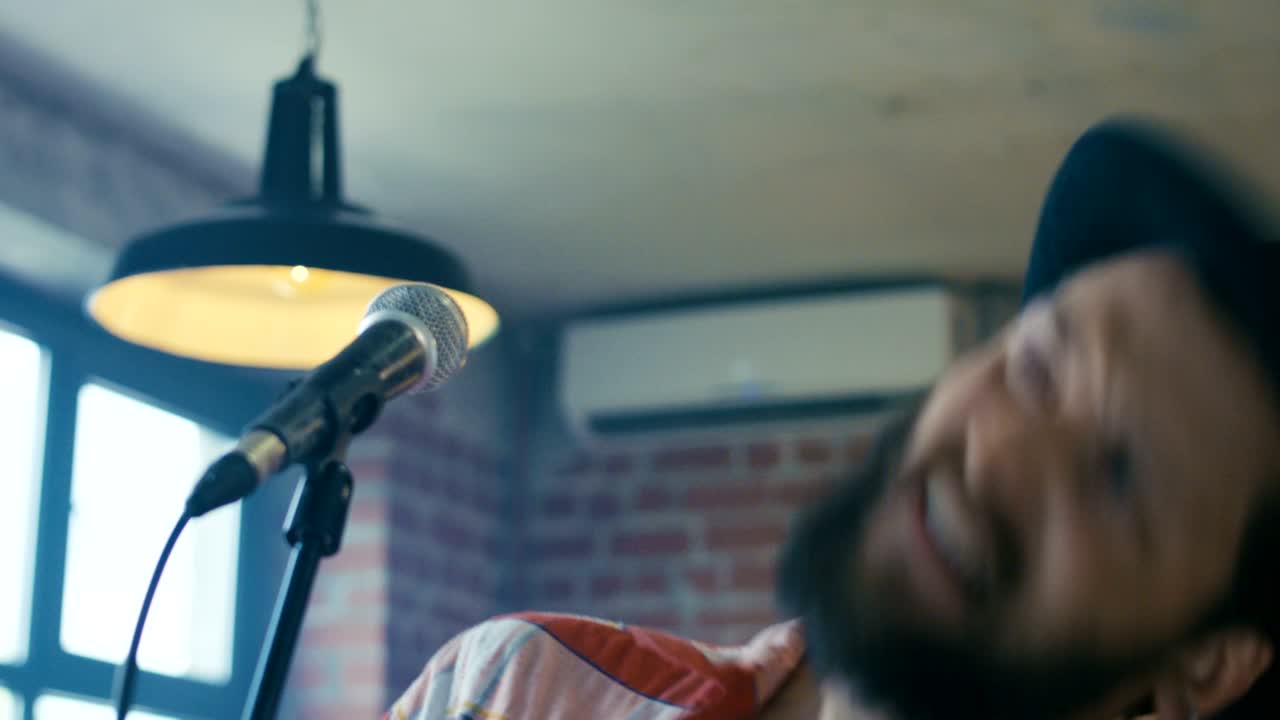 Singing guitarist in hat