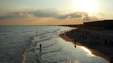 view from the pier as sun sets over folly beach, south carolina