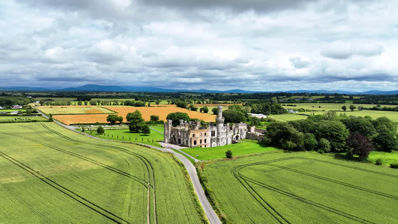Road to ruined castle through crops Ducketts Grove Carlow Ireland epic locations in summer