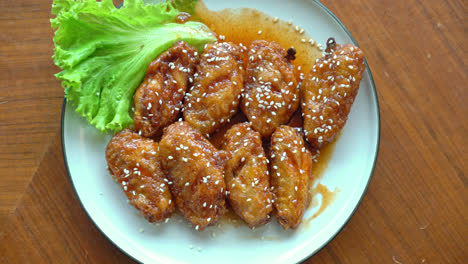 fried chicken with korean spicy sauce and white sesame