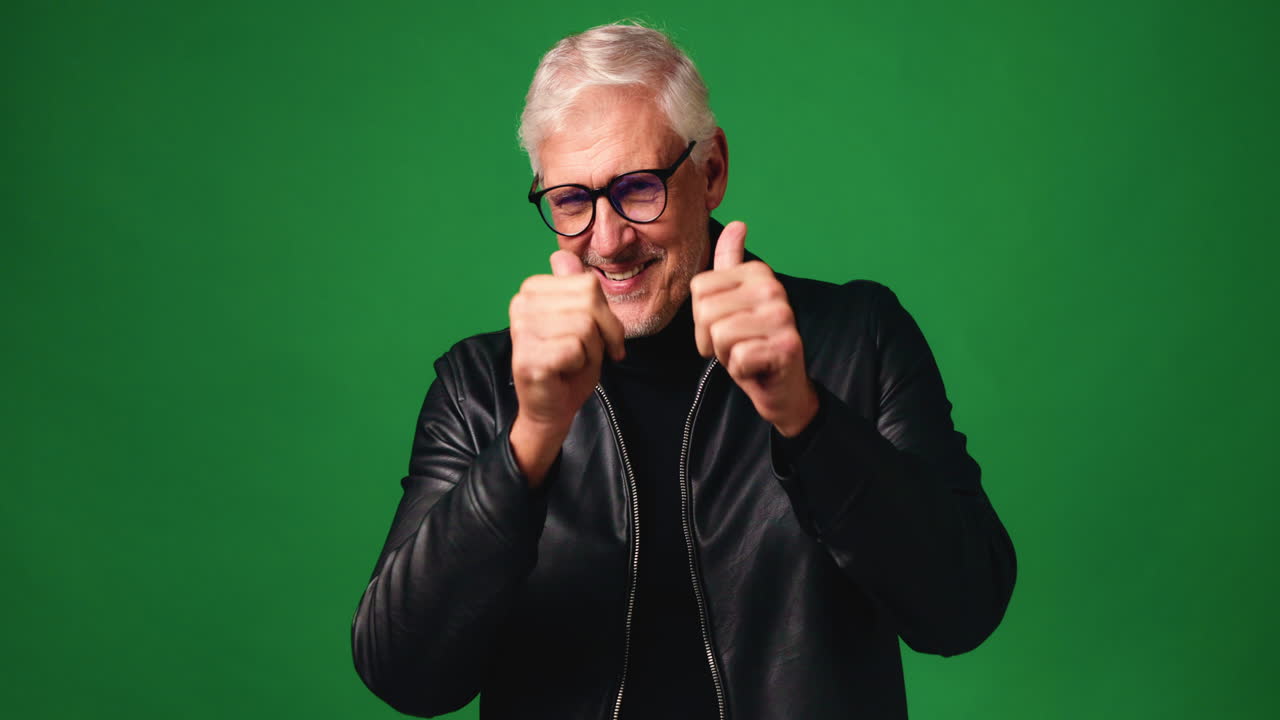 Man in leather jacket with glasses on green screen