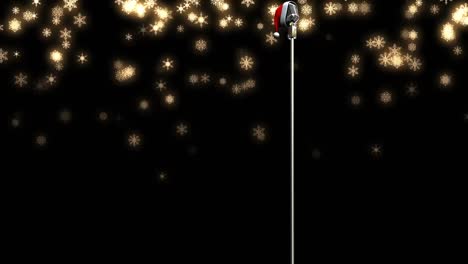 animation of snow falling over microphone with christmas hat on dark background