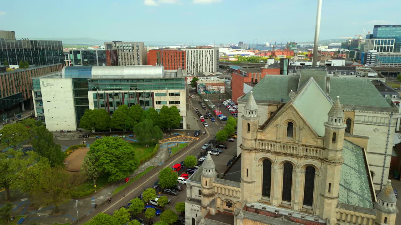 Front-on, advancing aerial video of St Anne's Cathedral in the Cathedral Quarter in Belfat City Centre, Northern Ireland on a bright and sunny day. Filmed in 4K, 60FPS and with Rec709 Color.