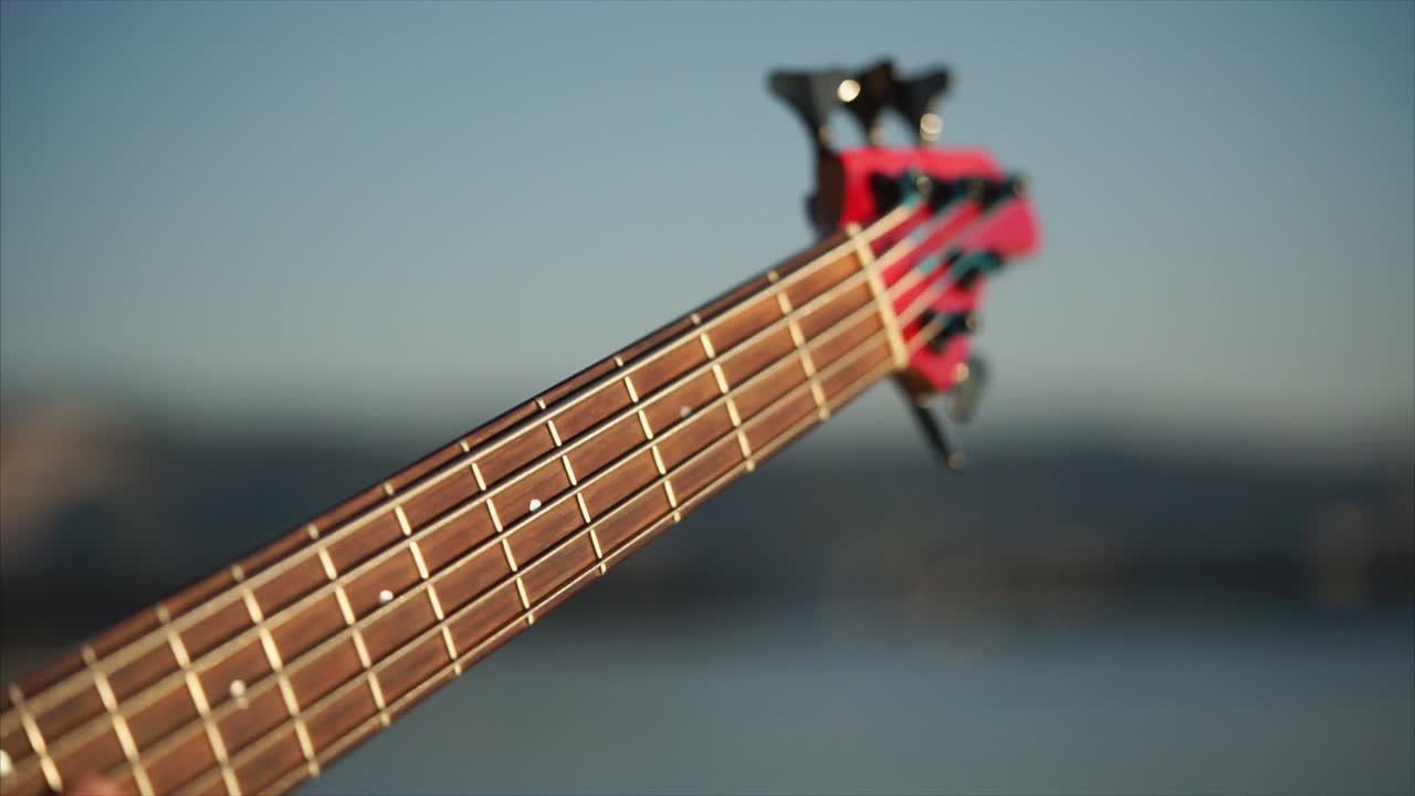 Playing Bass Guitar Outdoors