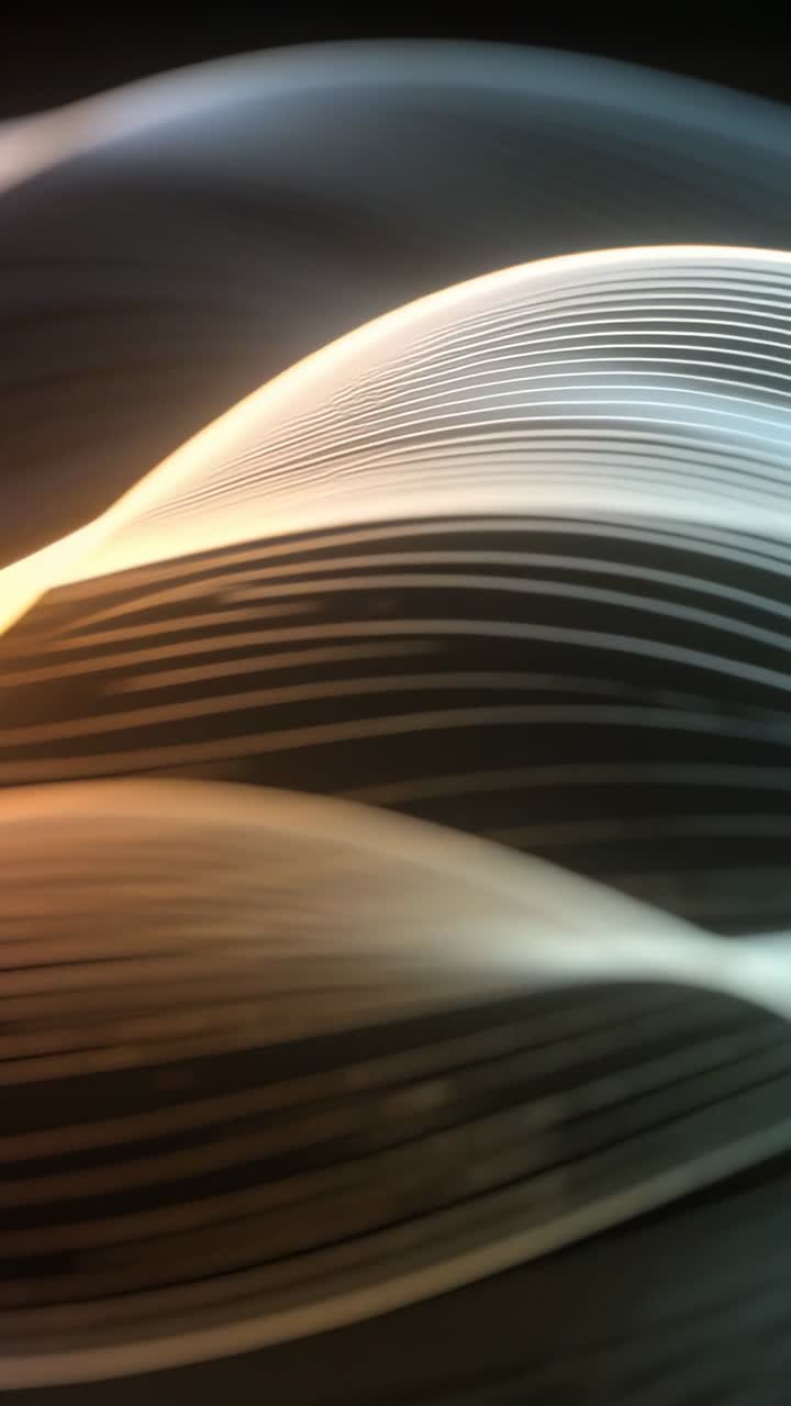 Vertical video: Playing glowing ribbon bands shifting across dark void, forming warm cool braided X