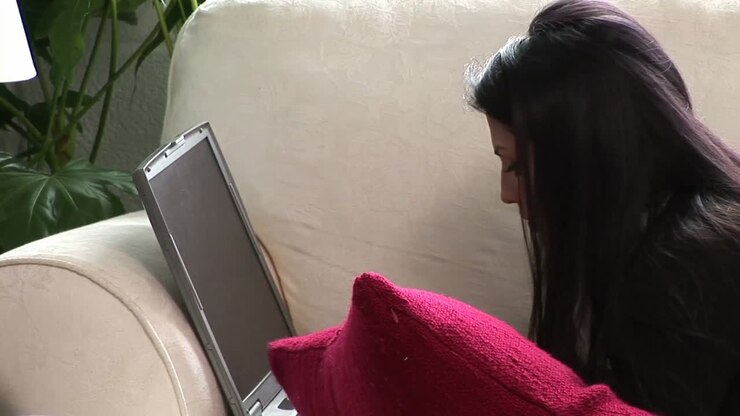 Woman on Sofa with Laptop