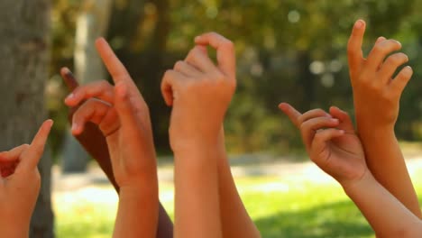 group of schoolkids playing in park