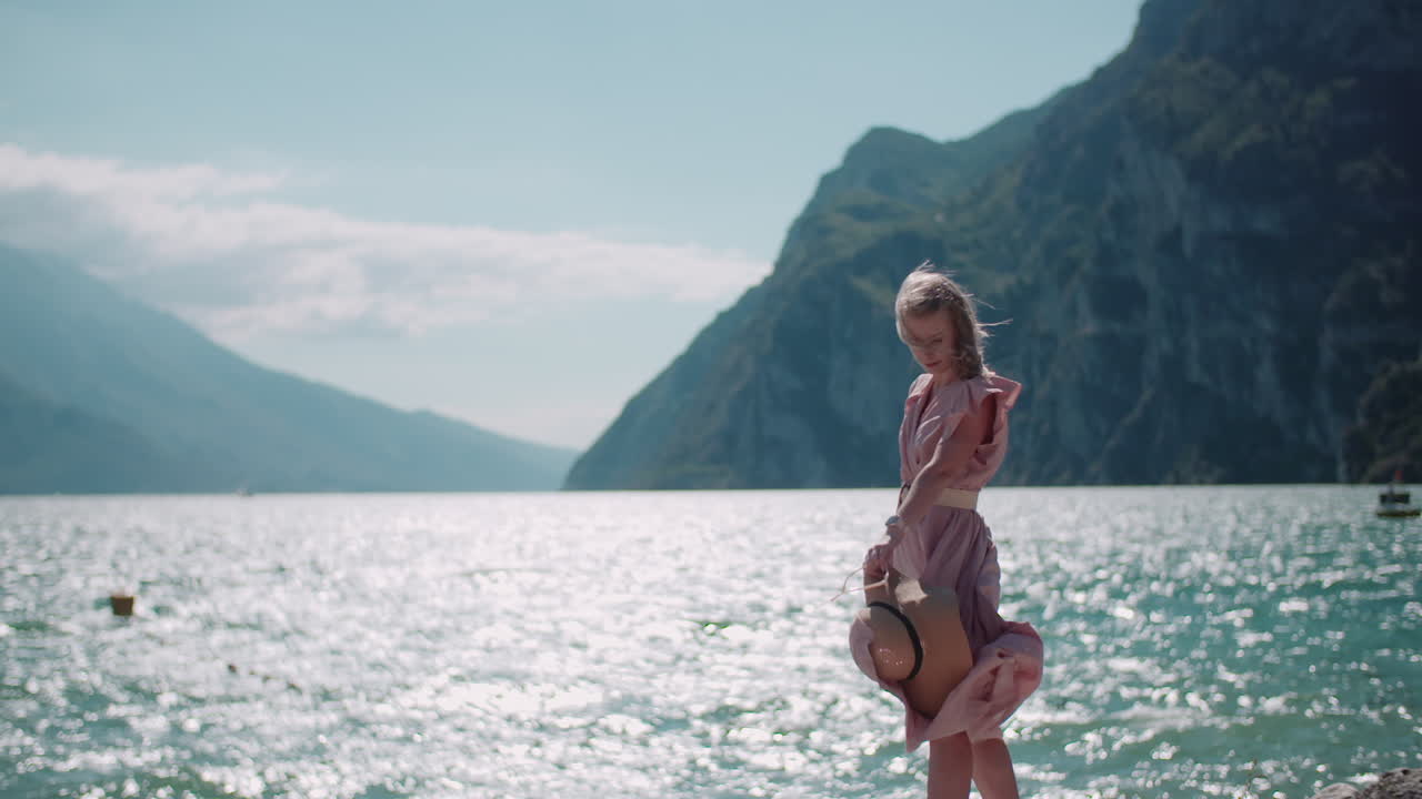Woman by Mountains and Sea with Blue Water