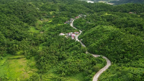 picturesque aerial view of serpentine roads along a lush hillside village in the tropical province catanduanes, philippines