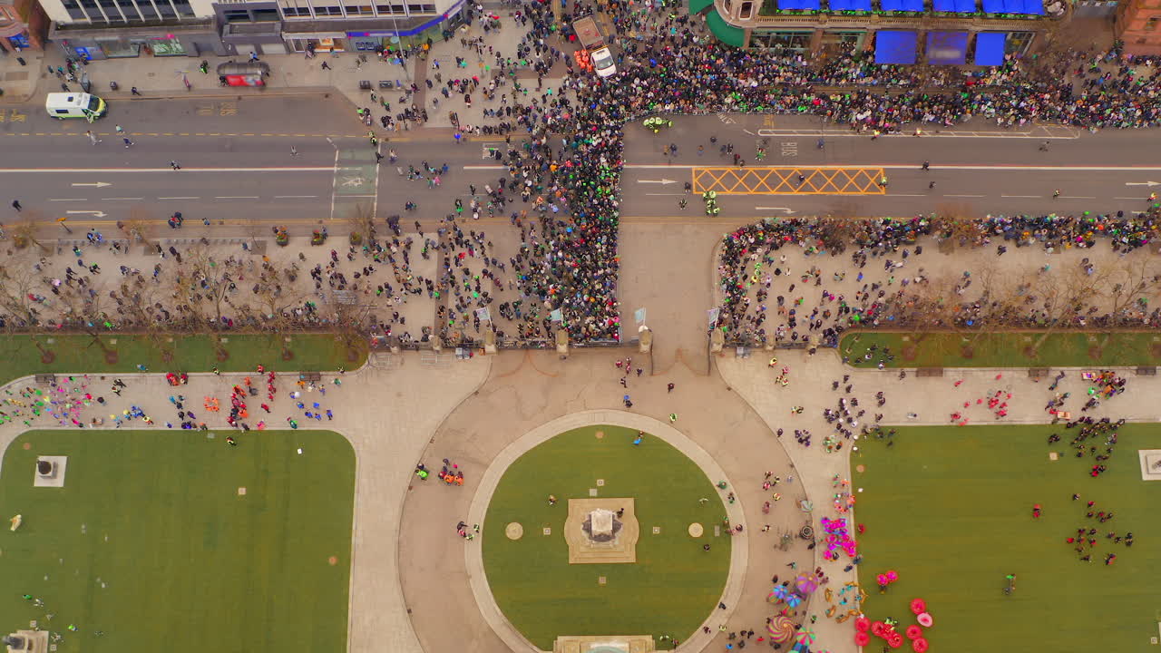 Static aerial view of performers and spectators at Belfast Town Hall during St. Patrick’s Day