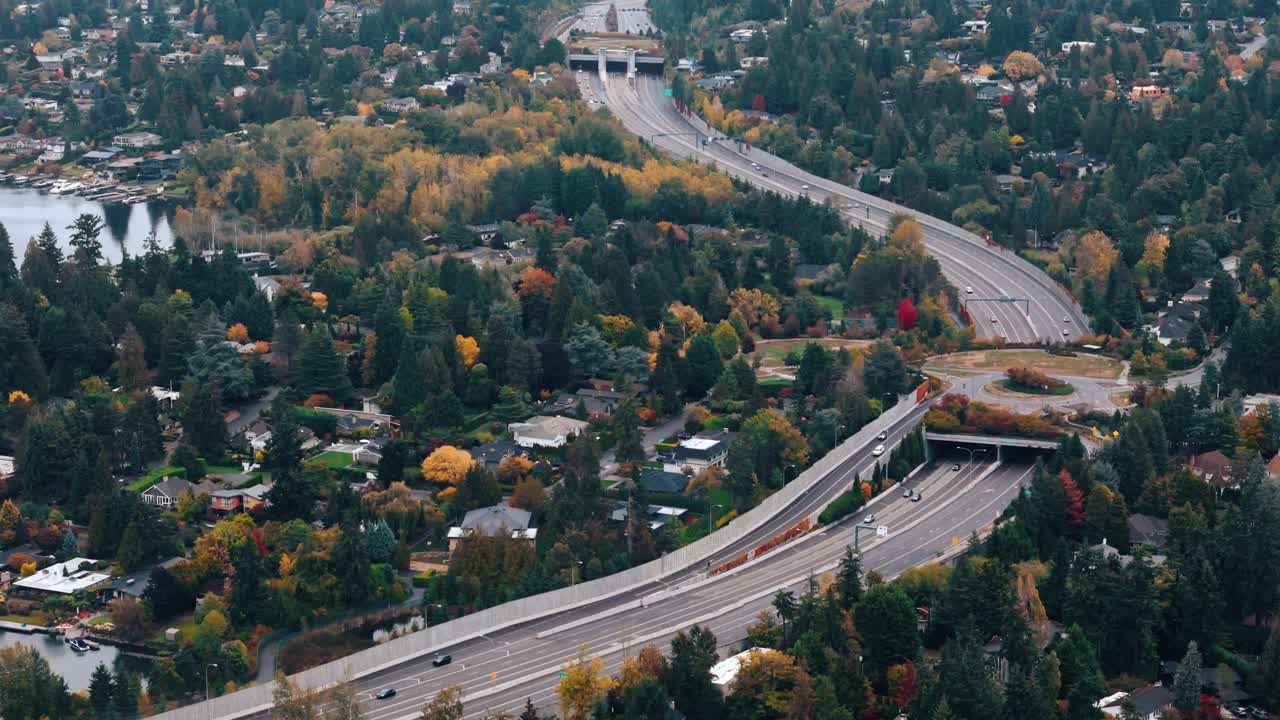 Approaching a winding freeway through brilliant autumn forest colors