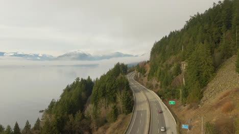 aerial panoramic view of sea to sky highway near horseshoe bay during a sunny winter evening before sunset