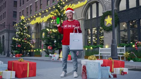 man shopping on christmas street