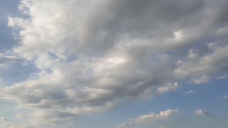 Mid-afternoon-thunderstorm-rain-clouds-forming-and-blending-across-the-african-horizon-time-lapse,-noise-free-4k-footage