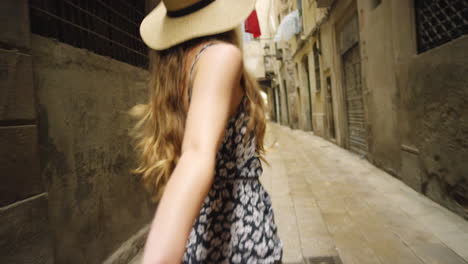 woman being led through a barcelona alley