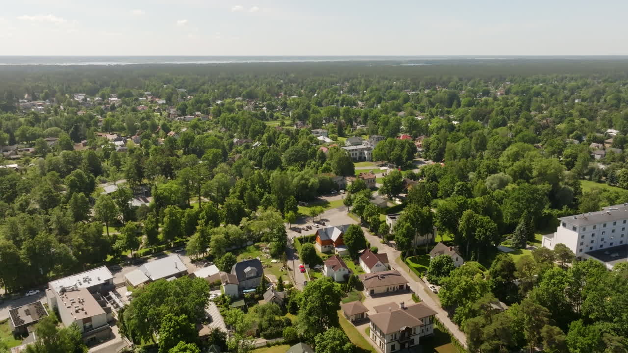 Drone flying over a residential neighborhood, sunny, summer day in Latvia