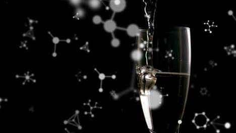 animation of networks floating over champagne glass on black background