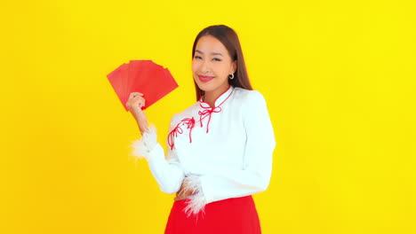 an attractive young woman holds a fan of cards available for composite