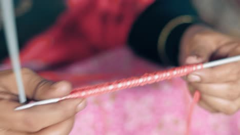 Close-up-of-the-first-row-of-knitting-in-red-color