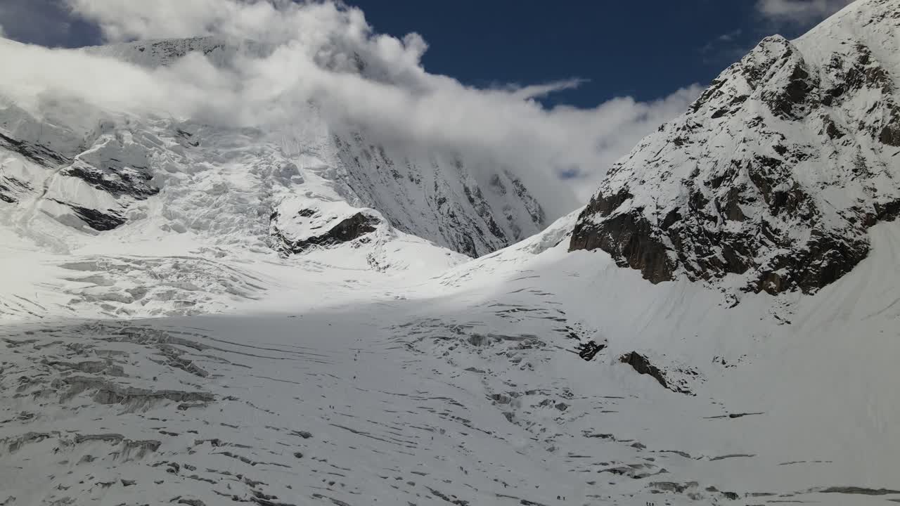 A stunning aerial view reveals the icy approach toward Mount Everest, where glacier textures and massive Himalayan peaks shape the dramatic high-altitude landscape of Nepal’s rugged mountains