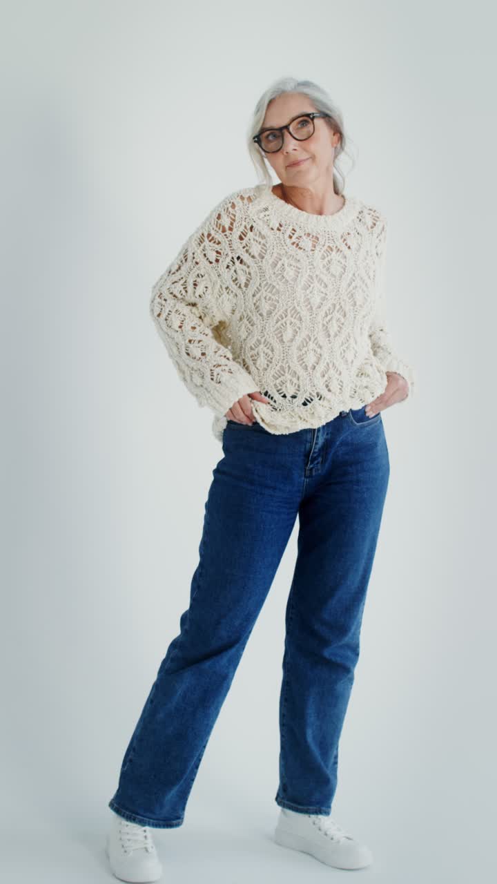 Senior woman in sweater and jeans