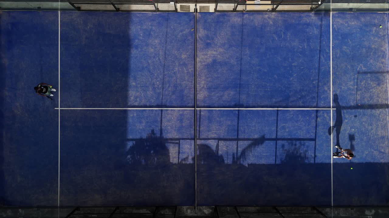Aerial view of a padel court with players
