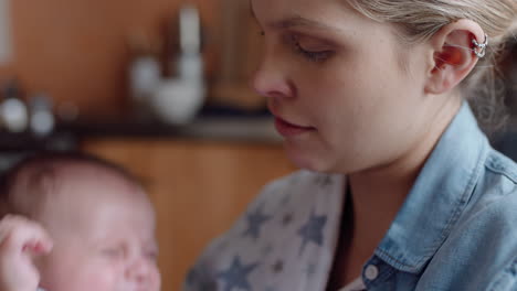 young mother feeding unhappy baby drinking from milk bottle crying restless infant at home with tired mom