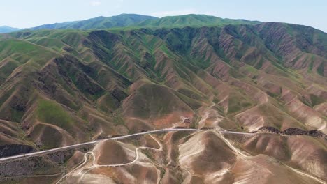 aerial view of scenic road in kyrgyzstan toktogul lake , travel destination adventure in central asia