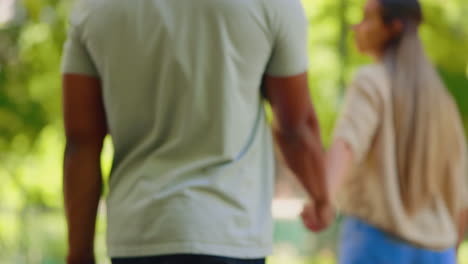 back of happy couple, walking