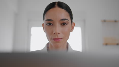 pensive businesswoman working laptop at home table closeup. woman looking screen