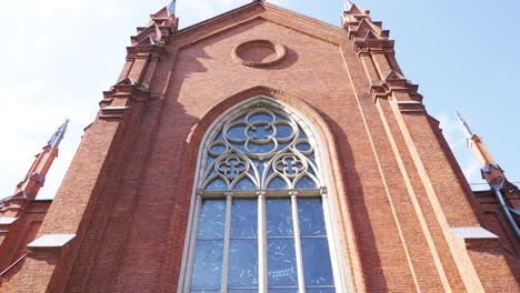 detailed view of a red brick church facade