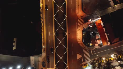 Christmas-lights-crossing-river-passing-through-Funchal-city,-Rua-Brigadeiro-Oudinot,-aerial