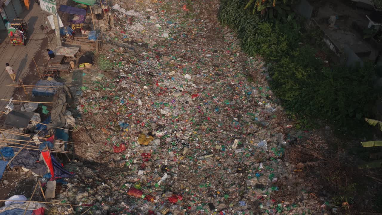 Polluted river in Dhaka filled with plastic waste, urban environmental crisis