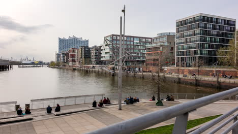 Hamburg-downtown-Hafencity-people-walking-around-Grasbrook-harbor-and-Marco-Polo-Terrassen,-Time-Lapse